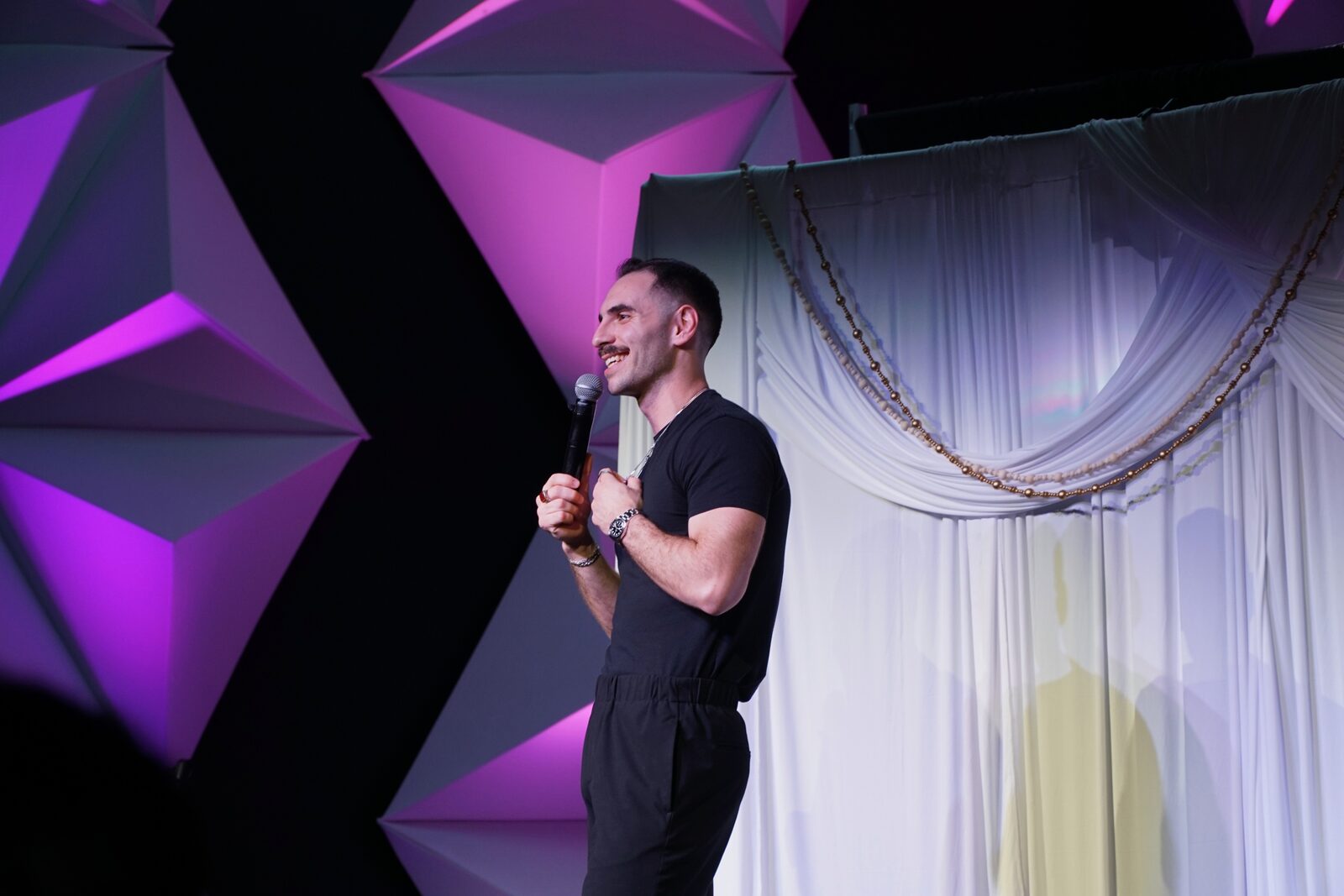 Zaid Fouzi delivering a punchline at OU Arab Students Comedy Night, Norman OK